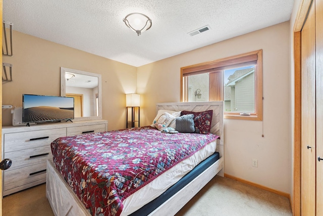 9055 Regent Pkwy, Brooklyn Park, MN 55443 - bedroom with carpet floors and a textured ceiling