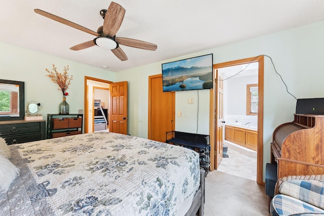 9055 Regent Pkwy, Brooklyn Park, MN 55443 - carpeted bedroom featuring multiple windows, a ceiling fan, and ensuite bathroom