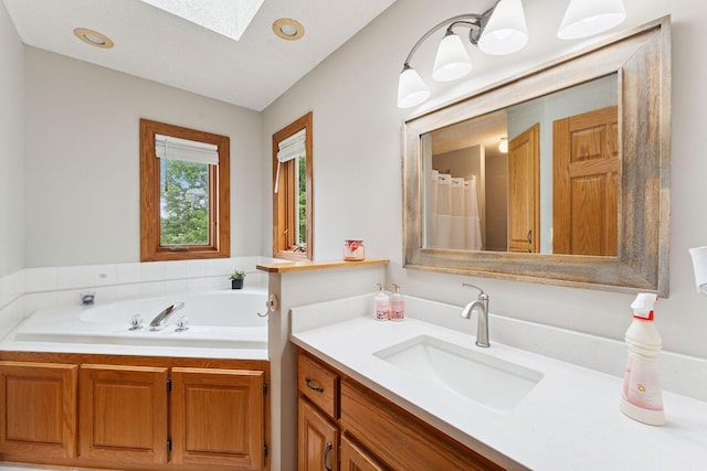 9055 Regent Pkwy, Brooklyn Park, MN 55443 - bathroom with a skylight, vanity, a garden tub, and curtained shower