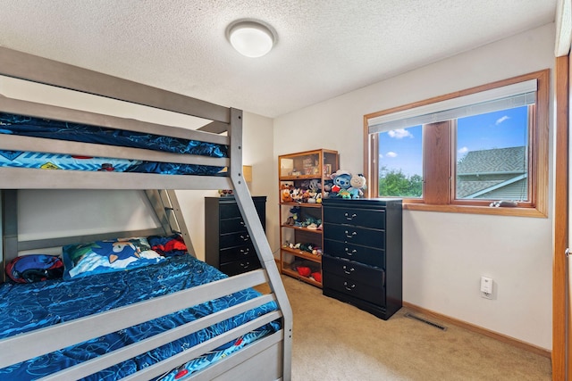 9055 Regent Pkwy, Brooklyn Park, MN 55443 - bedroom with carpet flooring and a textured ceiling