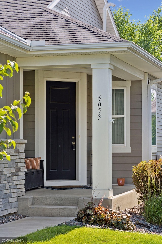 5053 Sunstream Ln, Woodbury, MN 55129 - doorway to property with a shingled roof