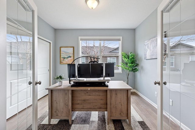 5053 Sunstream Ln, Woodbury, MN 55129 - office area with wood finished floors and french doors