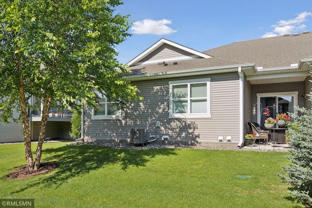 5053 Sunstream Ln, Woodbury, MN 55129 - view of side of property with a shingled roof and a lawn