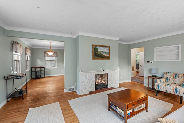 1062 Ohio St, West Saint Paul, MN 55118 - living area with wood finished floors and a multi sided fireplace