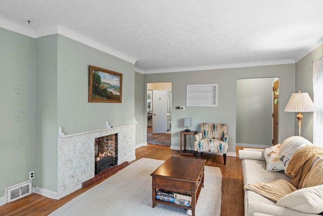 1062 Ohio St, West Saint Paul, MN 55118 - living area featuring wood finished floors and a fireplace