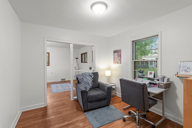 1062 Ohio St, West Saint Paul, MN 55118 - office area featuring wood finished floors and baseboards