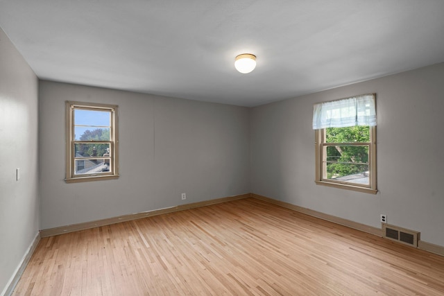 1062 Ohio St, West Saint Paul, MN 55118 - unfurnished room featuring light wood-type flooring and plenty of natural light