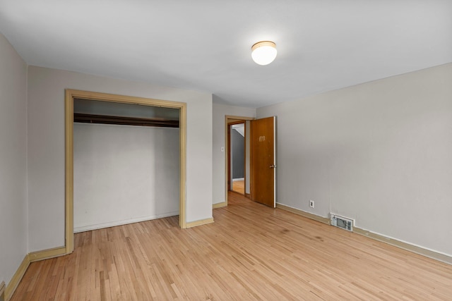 1062 Ohio St, West Saint Paul, MN 55118 - unfurnished bedroom featuring wood finished floors and a closet