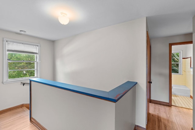 1062 Ohio St, West Saint Paul, MN 55118 - corridor with baseboards and light wood finished floors