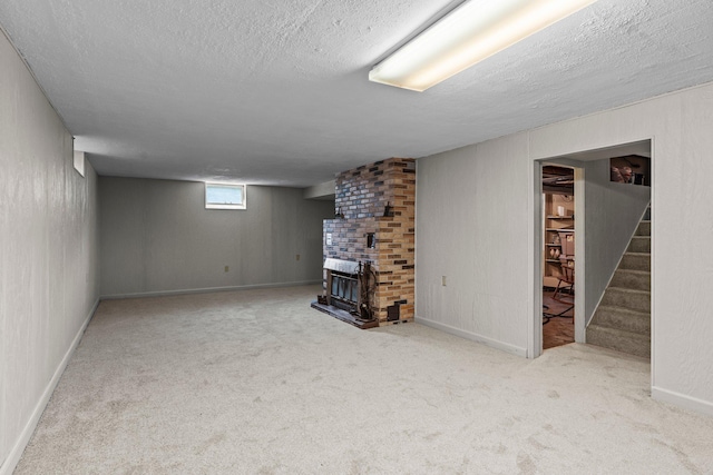 1062 Ohio St, West Saint Paul, MN 55118 - basement with carpet floors, a textured ceiling, stairway, and a brick fireplace