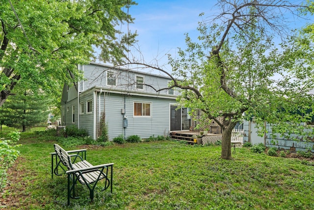 1062 Ohio St, West Saint Paul, MN 55118 - back of house with a wooden deck and a yard