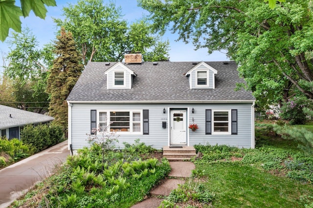 1062 Ohio St, West Saint Paul, MN 55118 - new england style home featuring roof with shingles and a chimney