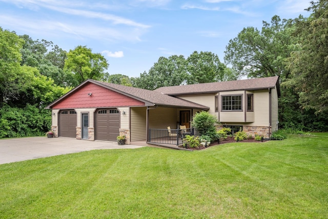13326 Mallard Dr SE, Becker Twp, MN 55308 - split level home with a front yard, stone siding, an attached garage, concrete driveway, and a shingled roof