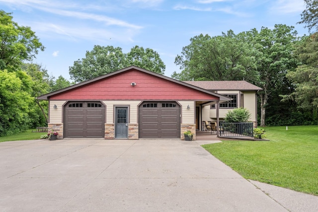 13326 Mallard Dr SE, Becker Twp, MN 55308 - view of front of house featuring stone siding, a front lawn, and a detached garage