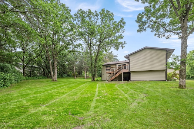 13326 Mallard Dr SE, Becker Twp, MN 55308 - view of grassy yard featuring stairway and a wooden deck