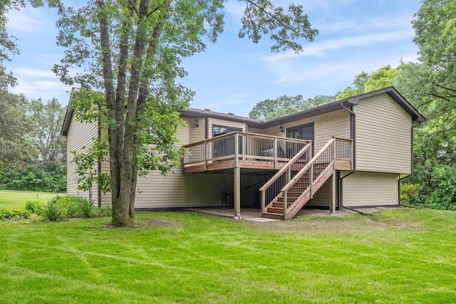 13326 Mallard Dr SE, Becker Twp, MN 55308 - back of house featuring a deck, stairs, and a lawn