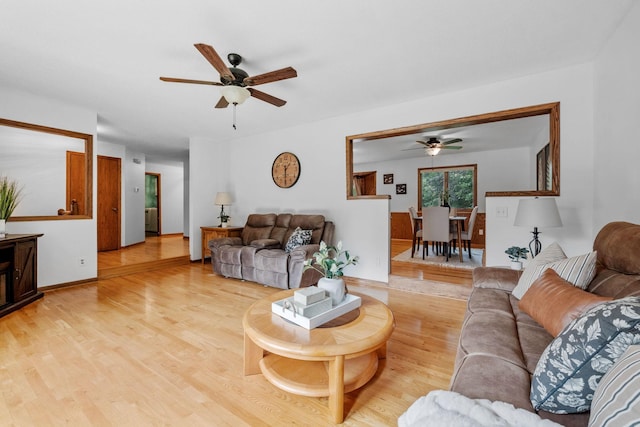 13326 Mallard Dr SE, Becker Twp, MN 55308 - living area with ceiling fan and light wood-style flooring