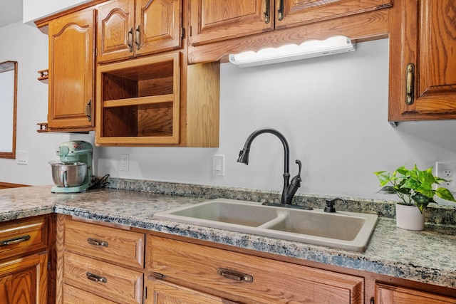13326 Mallard Dr SE, Becker Twp, MN 55308 - kitchen featuring brown cabinetry
