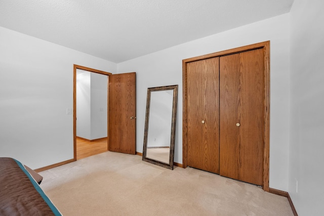 13326 Mallard Dr SE, Becker Twp, MN 55308 - unfurnished bedroom featuring light colored carpet and a closet