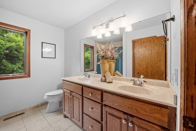 13326 Mallard Dr SE, Becker Twp, MN 55308 - full bathroom with double vanity, plenty of natural light, tile patterned flooring, and curtained shower