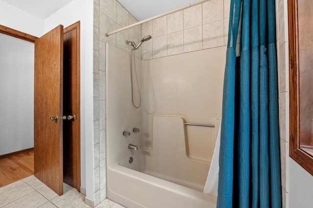 13326 Mallard Dr SE, Becker Twp, MN 55308 - bathroom featuring shower / tub combo with curtain and tile patterned flooring