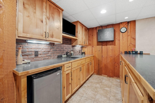 13326 Mallard Dr SE, Becker Twp, MN 55308 - kitchen featuring refrigerator, backsplash, a paneled ceiling, wooden walls, and recessed lighting