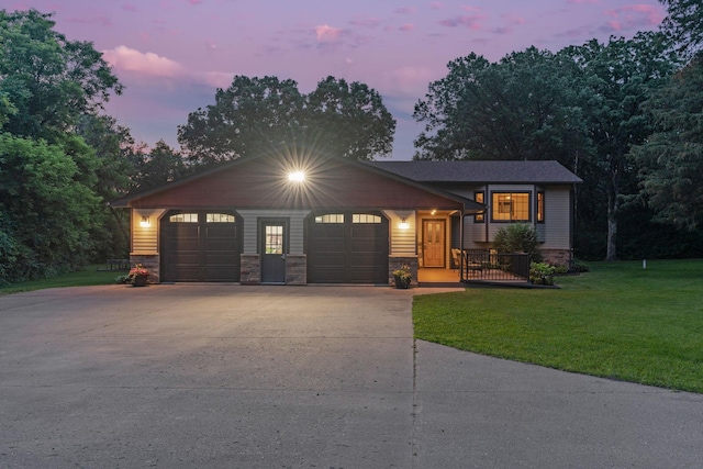 13326 Mallard Dr SE, Becker Twp, MN 55308 - split level home featuring driveway, a lawn, a garage, and stone siding