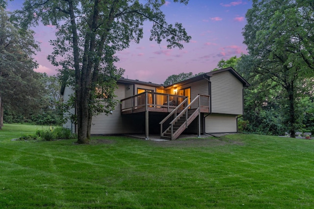 13326 Mallard Dr SE, Becker Twp, MN 55308 - back of house featuring a wooden deck, stairway, and a yard