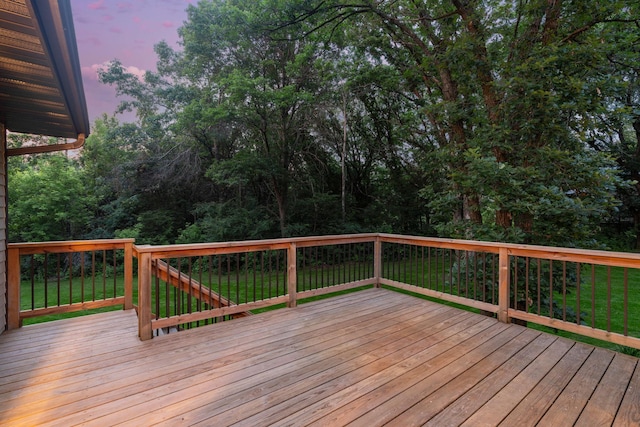 13326 Mallard Dr SE, Becker Twp, MN 55308 - deck at dusk featuring a lawn