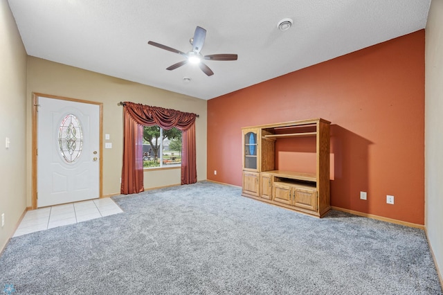 1403 2nd Ave NE, Barnesville, MN 56514 - unfurnished living room featuring a ceiling fan and light colored carpet