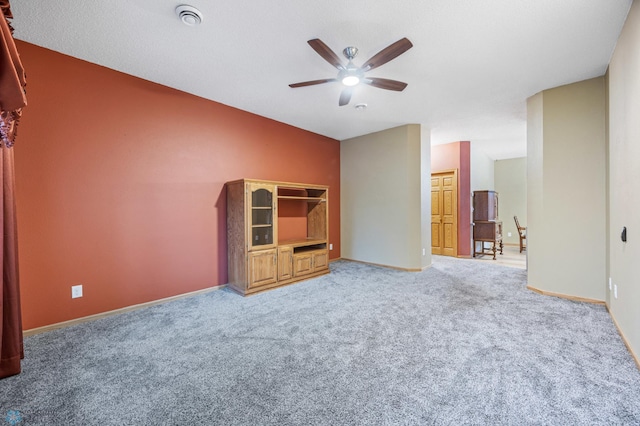 1403 2nd Ave NE, Barnesville, MN 56514 - unfurnished living room with a ceiling fan and carpet