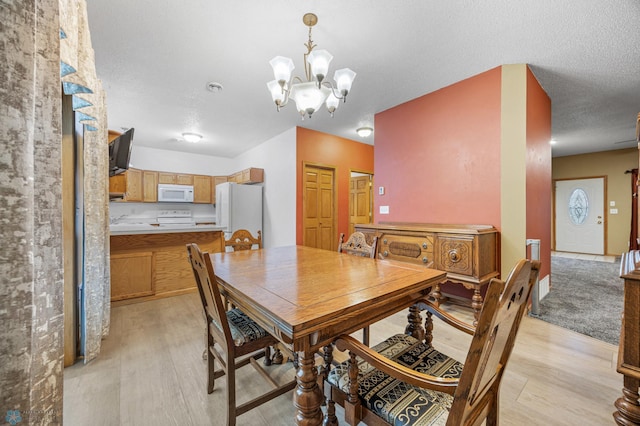 1403 2nd Ave NE, Barnesville, MN 56514 - dining room with a chandelier and light wood-style flooring