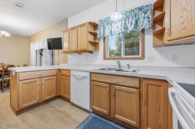 1403 2nd Ave NE, Barnesville, MN 56514 - kitchen with dishwasher, open shelves, a peninsula, light countertops, and a chandelier