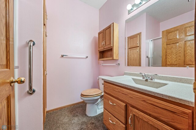 1403 2nd Ave NE, Barnesville, MN 56514 - bathroom featuring vanity and a shower with shower door