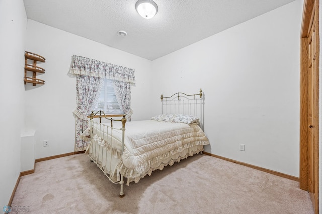 1403 2nd Ave NE, Barnesville, MN 56514 - carpeted bedroom with baseboards and a textured ceiling
