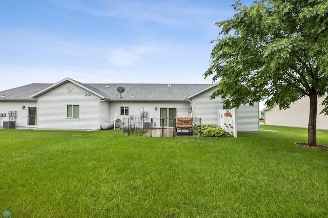 1403 2nd Ave NE, Barnesville, MN 56514 - rear view of house featuring a lawn and roof with shingles