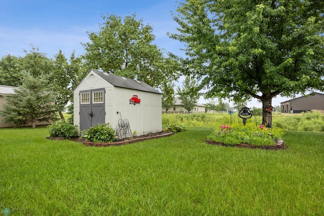 1403 2nd Ave NE, Barnesville, MN 56514 - view of grassy yard featuring a storage shed