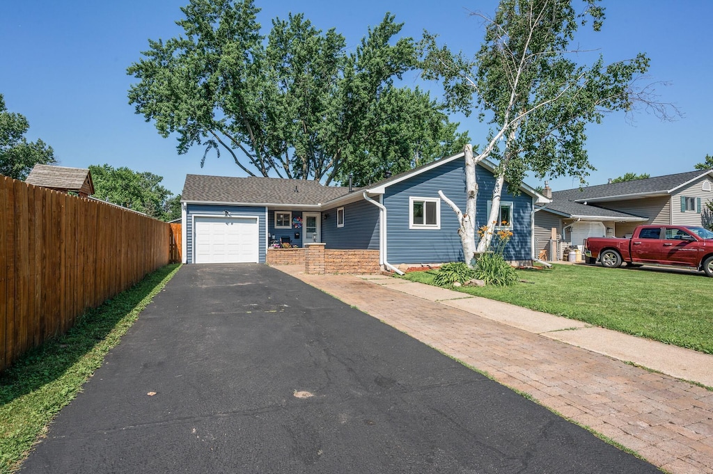 1959 Northwood Dr N, Saint Paul, MN 55109 - view of front of home with a garage, driveway, and brick siding