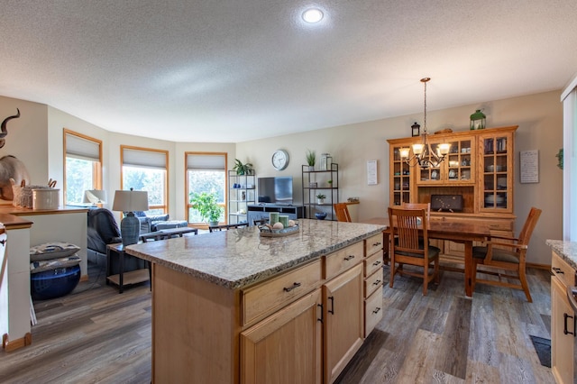 406 13th Ave NW, Kasson, MN 55944 - kitchen with dark wood-style flooring, a chandelier, a textured ceiling, open floor plan, and a center island