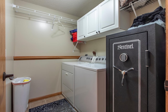 406 13th Ave NW, Kasson, MN 55944 - washroom with washer and clothes dryer, cabinet space, and light tile patterned flooring