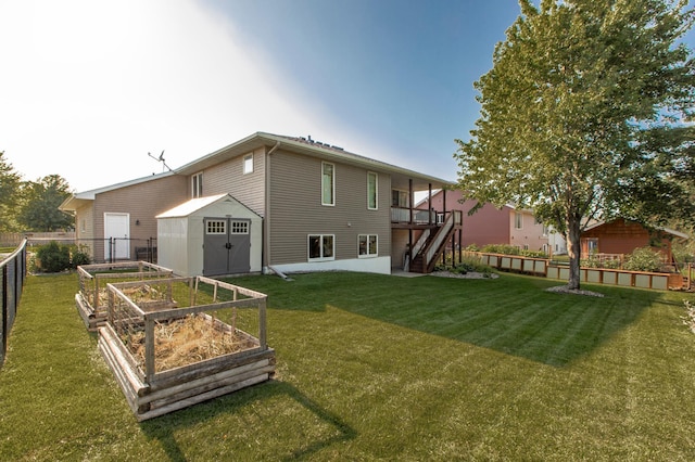 406 13th Ave NW, Kasson, MN 55944 - back of property with a garden, a storage unit, stairway, and a wooden deck