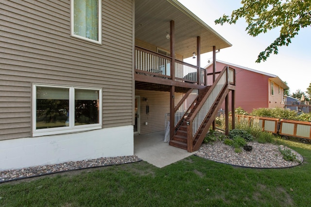 406 13th Ave NW, Kasson, MN 55944 - rear view of house with a deck, a patio area, and stairway