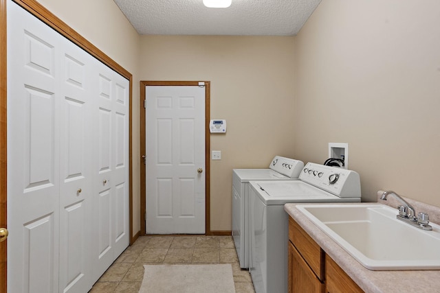 4543 Bloomberg Cir, Inver Grove Heights, MN 55076 - washroom featuring washer and clothes dryer, a textured ceiling, and cabinet space