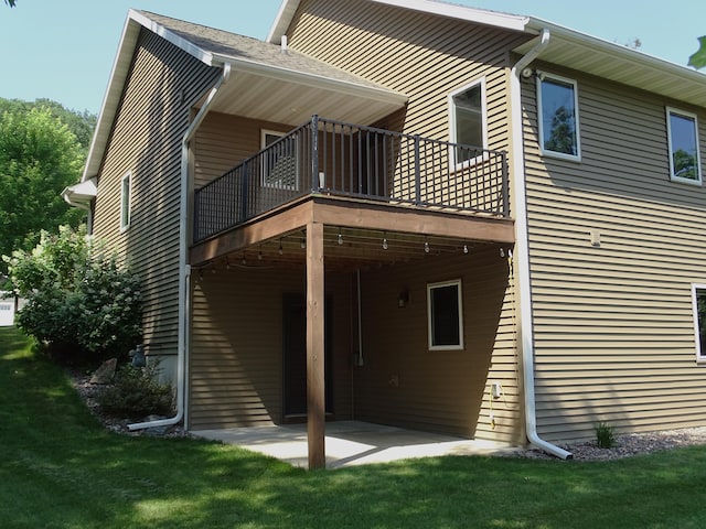224 Country Ln, Durand, WI 54736 - rear view of house with a yard, a wooden deck, and a patio