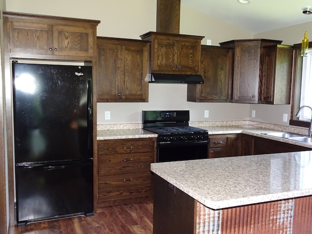 224 Country Ln, Durand, WI 54736 - kitchen featuring black appliances, ventilation hood, dark wood-style floors, light countertops, and vaulted ceiling