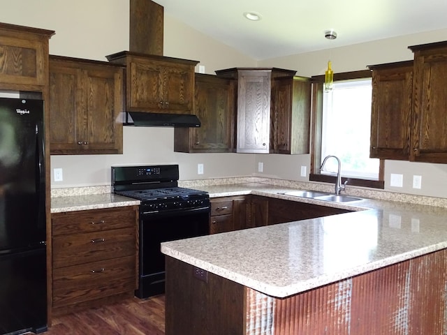 224 Country Ln, Durand, WI 54736 - kitchen featuring black appliances, ventilation hood, light countertops, dark wood-style floors, and vaulted ceiling