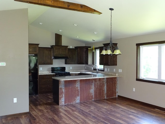 224 Country Ln, Durand, WI 54736 - kitchen featuring black appliances, dark wood-style floors, under cabinet range hood, dark brown cabinetry, and a peninsula