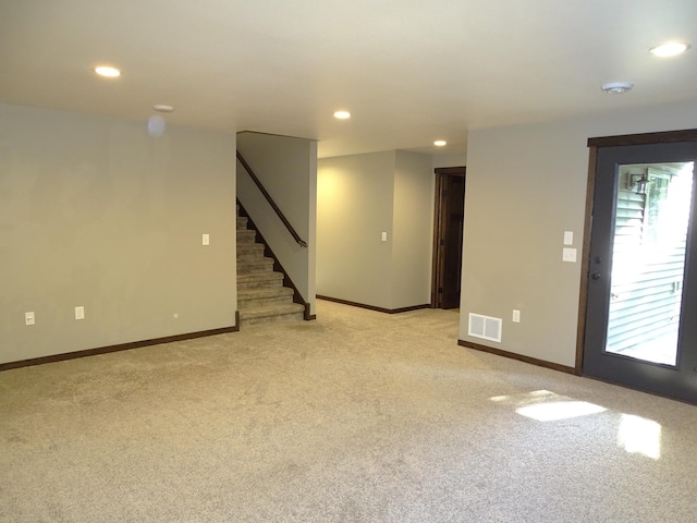 224 Country Ln, Durand, WI 54736 - spare room featuring light carpet, stairs, recessed lighting, and a smoke detector
