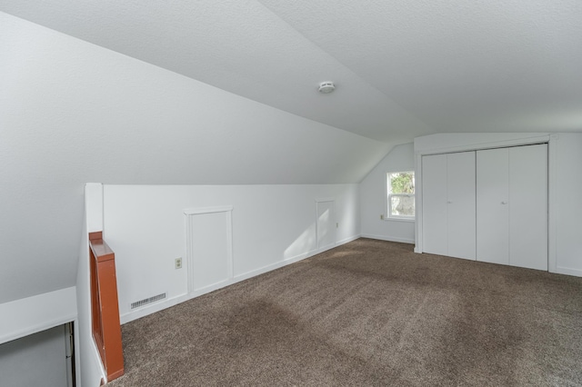 4163 Horseshoe Ct NE, Haverhill Twp, MN 55906 - bonus room featuring vaulted ceiling and carpet flooring