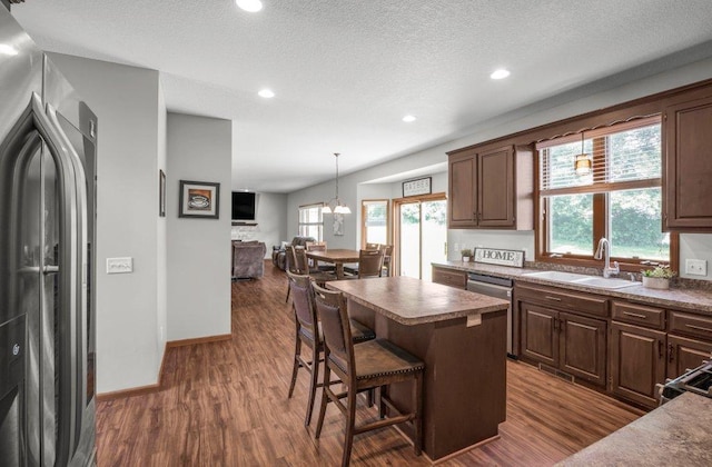 10695 184th Ave NW, Elk River, MN 55330 - kitchen featuring stainless steel appliances, dark wood-type flooring, healthy amount of natural light, recessed lighting, and a textured ceiling